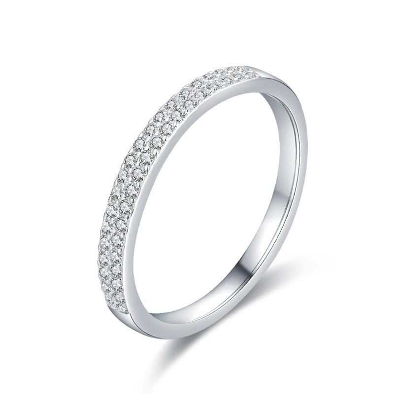 Silver ring with small diamonds on a white background